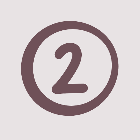 2 Zahl "2" in einem runden, braunen Rahmen auf hellem Hintergrund.